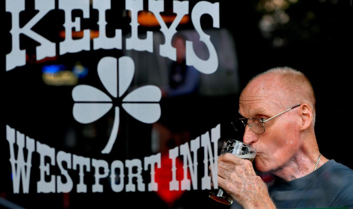 Roy Wiltrout, a fixture in the front window most afternoons, sips on a cold pint and takes in the passing scenery on Westport Road.