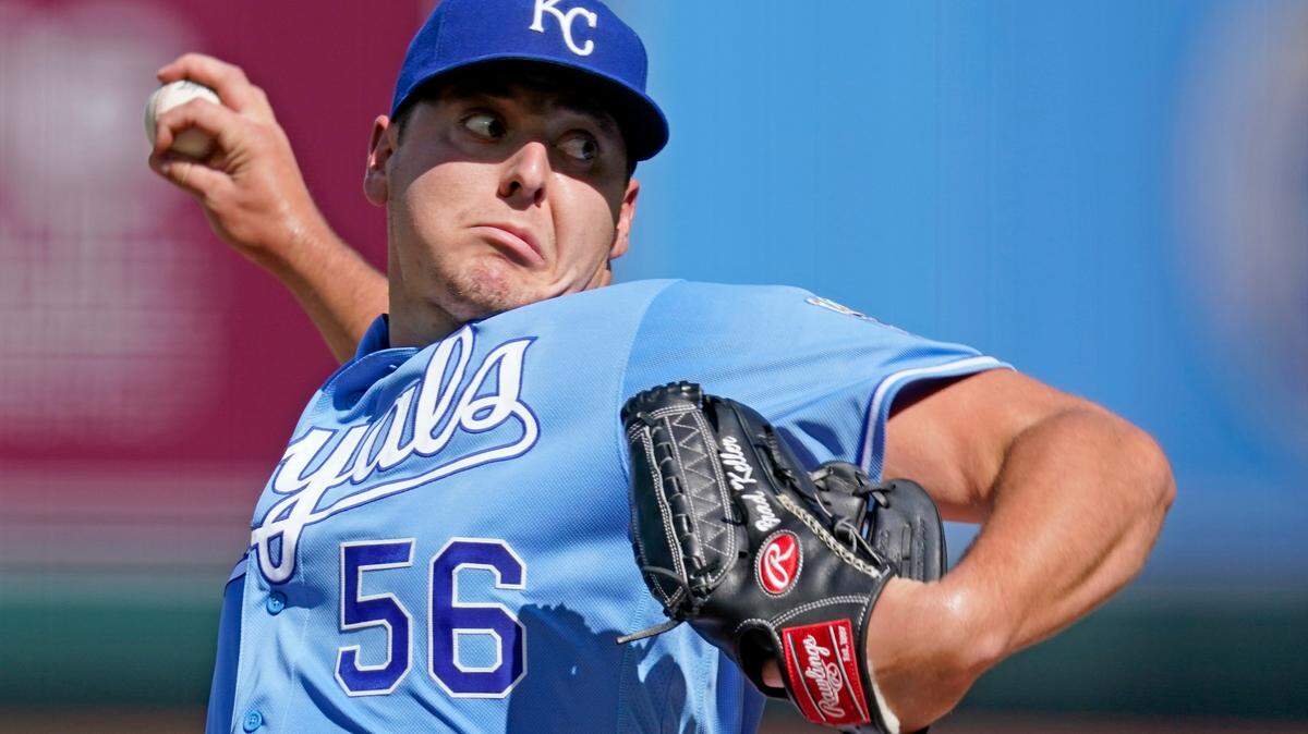 Kansas City Royals starting pitcher Brad Keller throws during the first inning of game one of a baseball doubleheader against the Cincinnati Reds Wednesday, Aug. 19, 2020, in Kansas City, Mo. (AP Photo/Charlie Riedel)