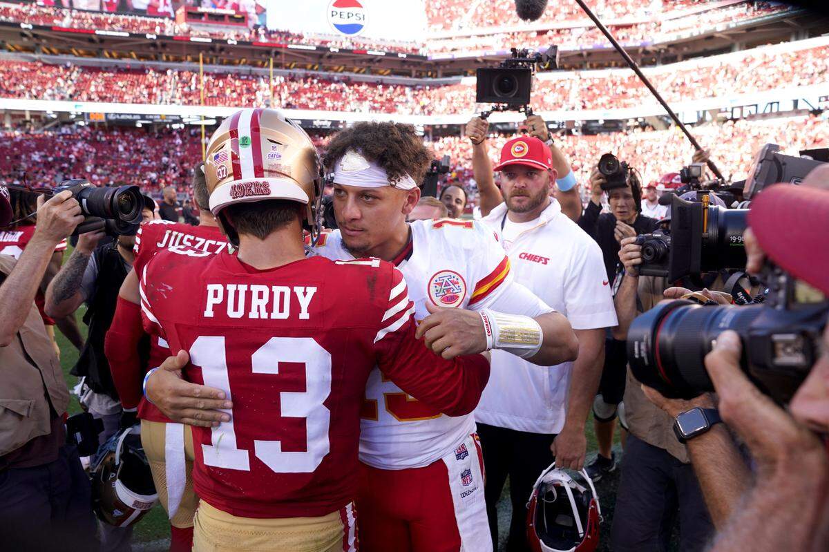 Kansas City Chiefs quarterback Patrick Mahomes, right, meets with San Francisco 49ers quarterback Brock Purdy after Saturday’s game at Levi’s Stadium in Santa Clara, Calif.