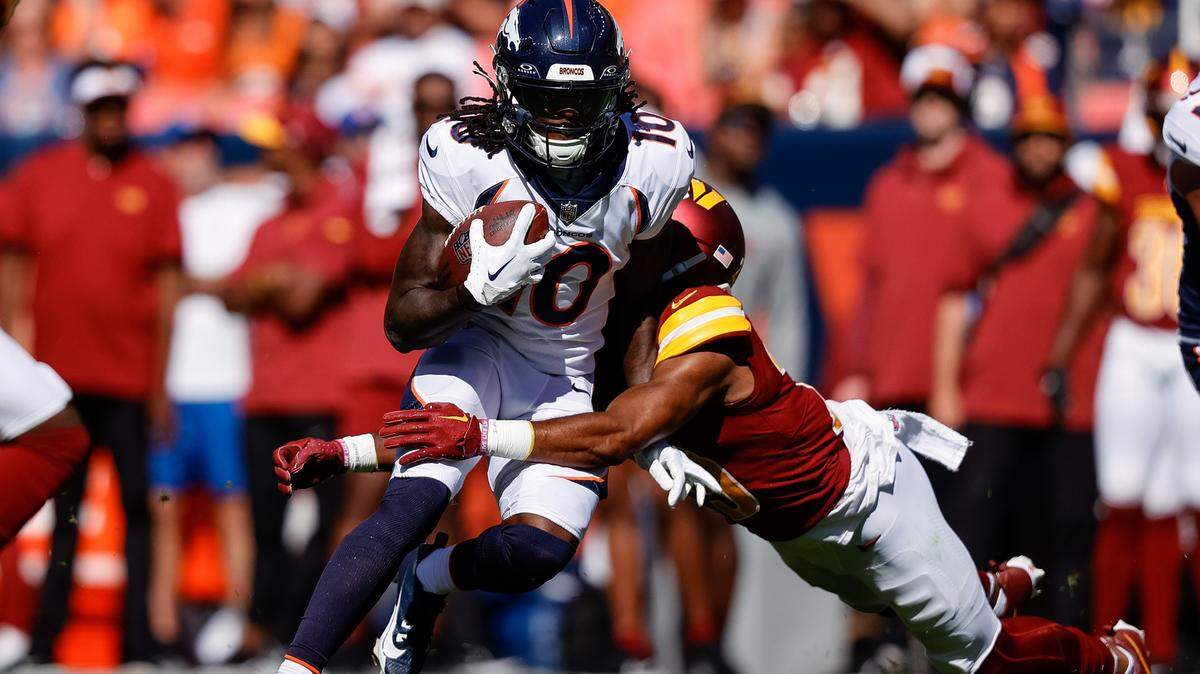 Sep 17, 2023; Denver, Colorado, USA; Denver Broncos wide receiver Jerry Jeudy (10) is tackled by Washington Commanders cornerback Kendall Fuller (29) in the second quarter at Empower Field at Mile High. Mandatory Credit: Isaiah J. Downing-USA TODAY Sports
