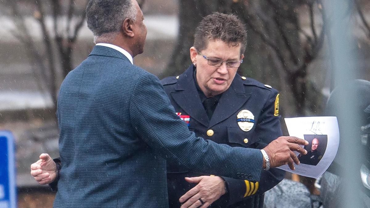Jackson County Executive Frank White, left, embraces a police officer after attending a visitation for fallen Independence police officer Cody Allen, 35, at Community of Christ on Thursday, March 7, 2024, in Independence. Allen, a husband and father of two children, was shot and killed last Thursday during an eviction in Independence.