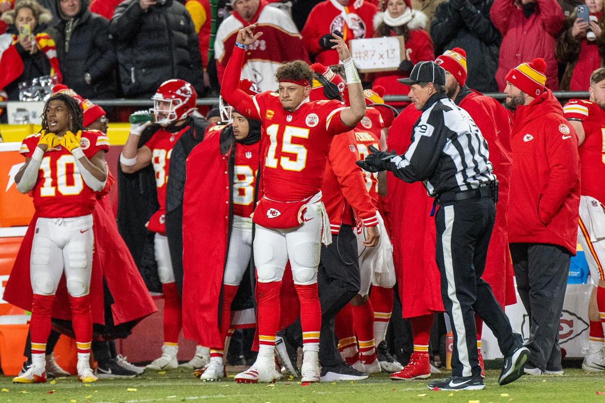 Kansas City Chiefs quarterback Patrick Mahomes (15) waves his hands up in attempt to pump up the crowd in the fourth quarter during the AFC Divisional Round playoff game against the Houston Texans on Saturday, Jan. 18, 2025, at GEHA Field at Arrowhead Stadium.