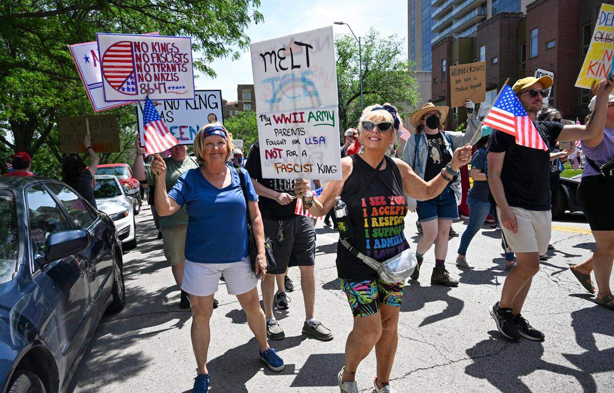 Participants in the “No Kings” day of defiance rally marched toward Westport after rallying earlier at Mill Creek Park on Saturday, June 14, 2025, in Kansas City