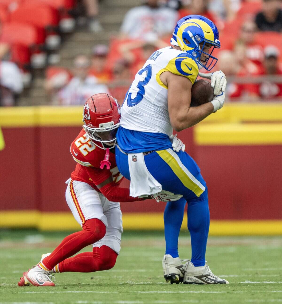 Kansas City Chiefs cornerback Jadon Canady (22) tackles Los Angeles Rams tight end Mark Redman (83) in the third quarter during an NFL preseason game at Arrowhead Stadium on Saturday, Aug. 15, 2026, in Kansas City.