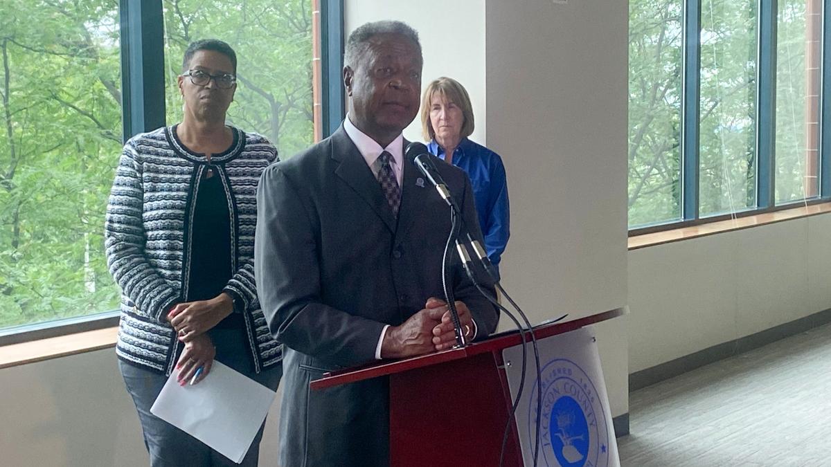 Jackson County Executive Frank White Jr. speaks at a press conference following the Missouri State Tax Commission’s order for the county to rollback property assessments. Assessment director Gail McCann Beatty and deputy county assessor Maureen Monaghan stand behind him.