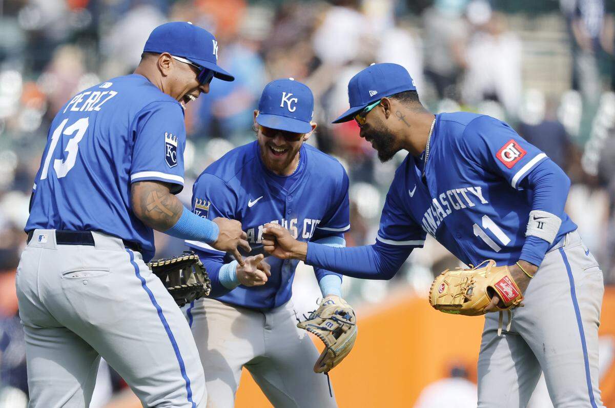 Kansas City Royals players (from left) Salvador Perez, Bobby Witt Jr. and Maikel Garcia celebrate a 4-3 win over the Tigers in 10 innings at Comerica Park in Detroit on April 20, 2025.