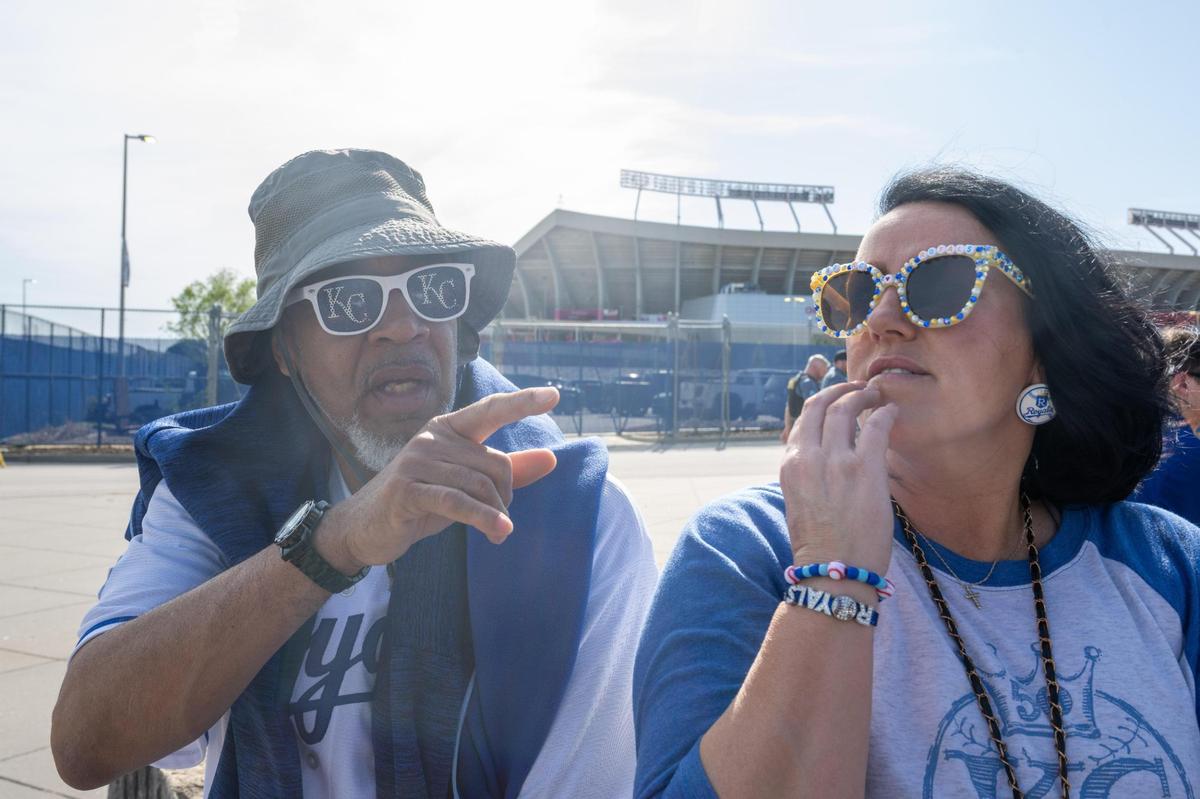 Jason Tatum and Michelle Hewy of Kansas City debate new stadium development in front of Kauffman Stadium prior to the Royals game vs. the Colorado Rockies on Tuesday. The two were split on whether they wanted a new stadium in downtown Kansas City.