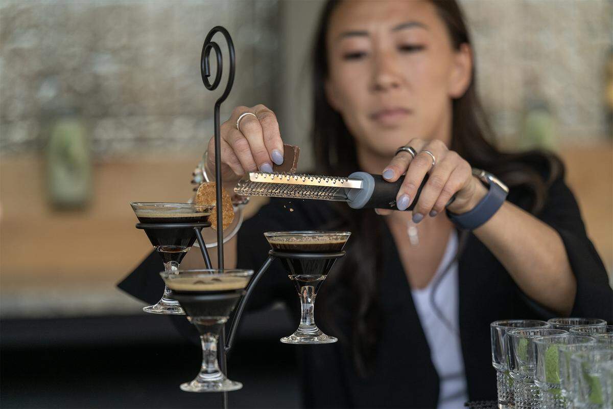 At the new Palm Tree Club in Kansas City's Power and Light District, Emily Lenderman, the director of beverage for Live! Hospitality and Entertainment, added a dash of chocolate to an espresso martini flight during a media preview on Thursday, September 4, 2025.