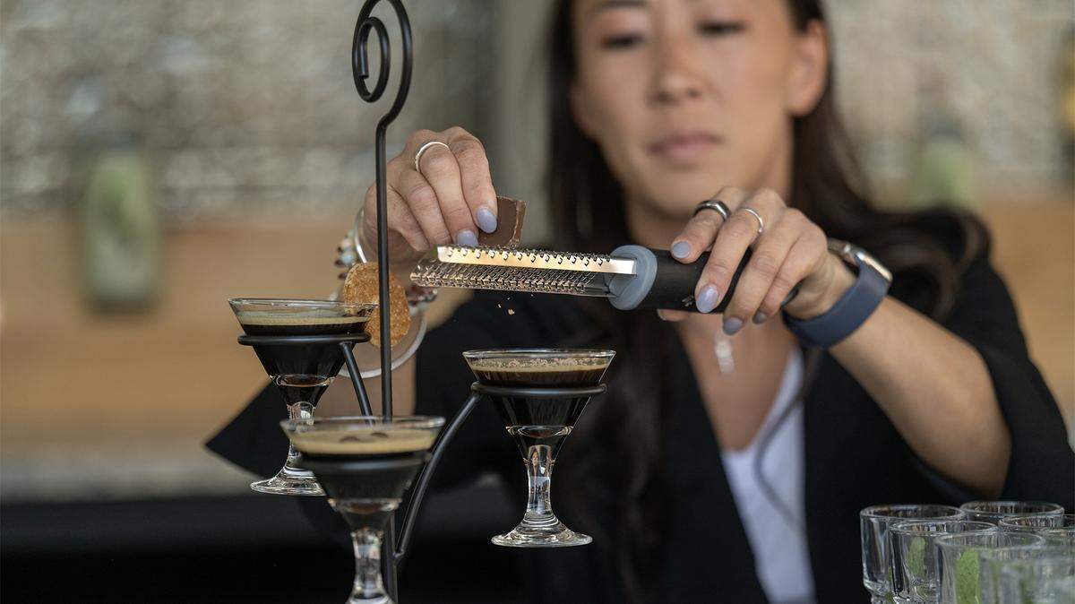 At the new Palm Beach Club in Kansas City's Power & Light District, Emily Lenderman, the director of beverage for Live! Hospitality and Entertainment, added a dash of chocolate to an espresso martini flight during a media preview on Thursday, September 4, 2025.