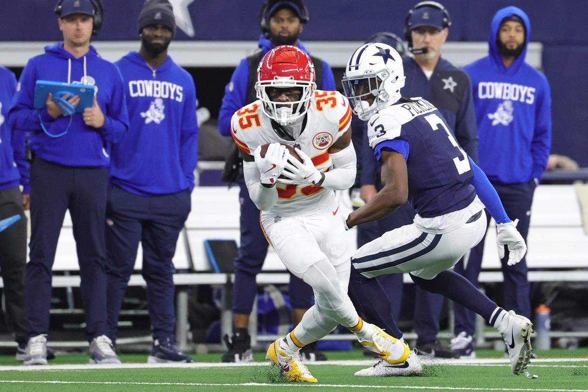 Kansas City Chiefs cornerback Jaylen Watson intercepts a pass intended for Cowboys wide receiver George Pickens during an NFL Week 13 Thanksgiving Day game at AT&T Stadium in Arlington, Texas on Thursday, Nov. 27, 2025.