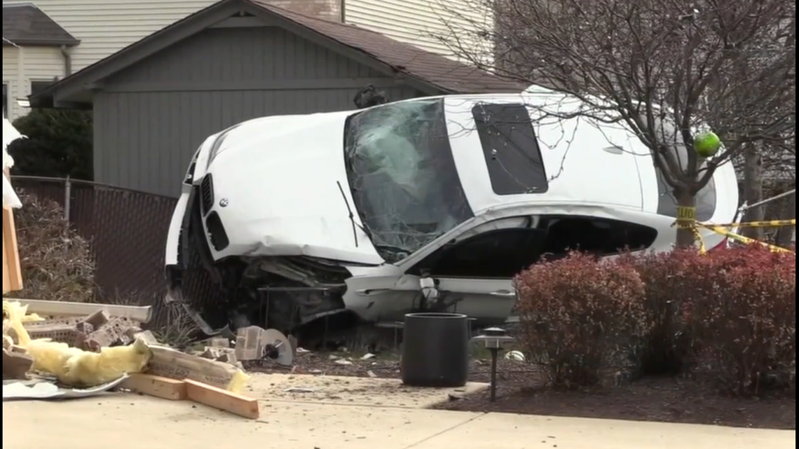 A car dealership employee crashed into an Elmhurst, Illinois, home while taking two customers on a BMW test drive, according to police.