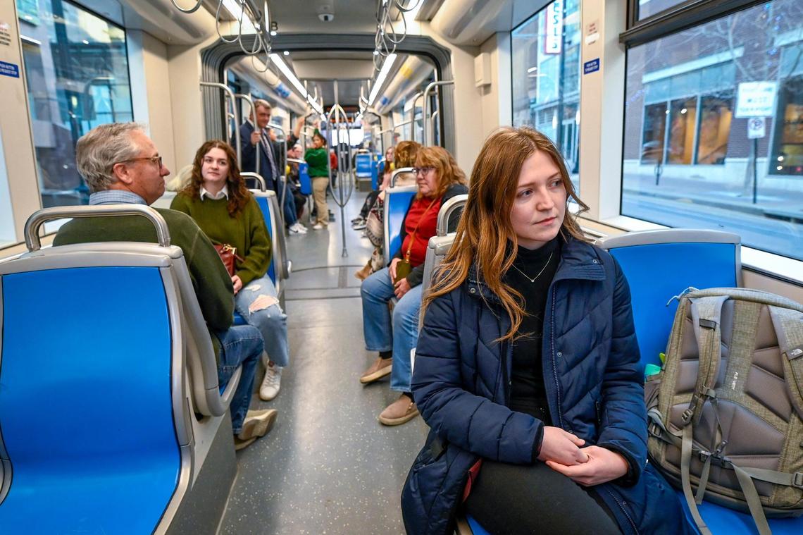 After getting off work, Sydney Crandall, 22, walks to catch the KC Streetcar where she rides to Union Station on Tuesday, Nov. 22, 2022, in Kansas City. On most days, Crandall choses communte to work by walking and riding public transportation to get to and from her job at HNTB, where she is an engineer in transportation, planning and policy. From Union Station, she will walk to her apartment near 28th Street and Grand Boulevard.