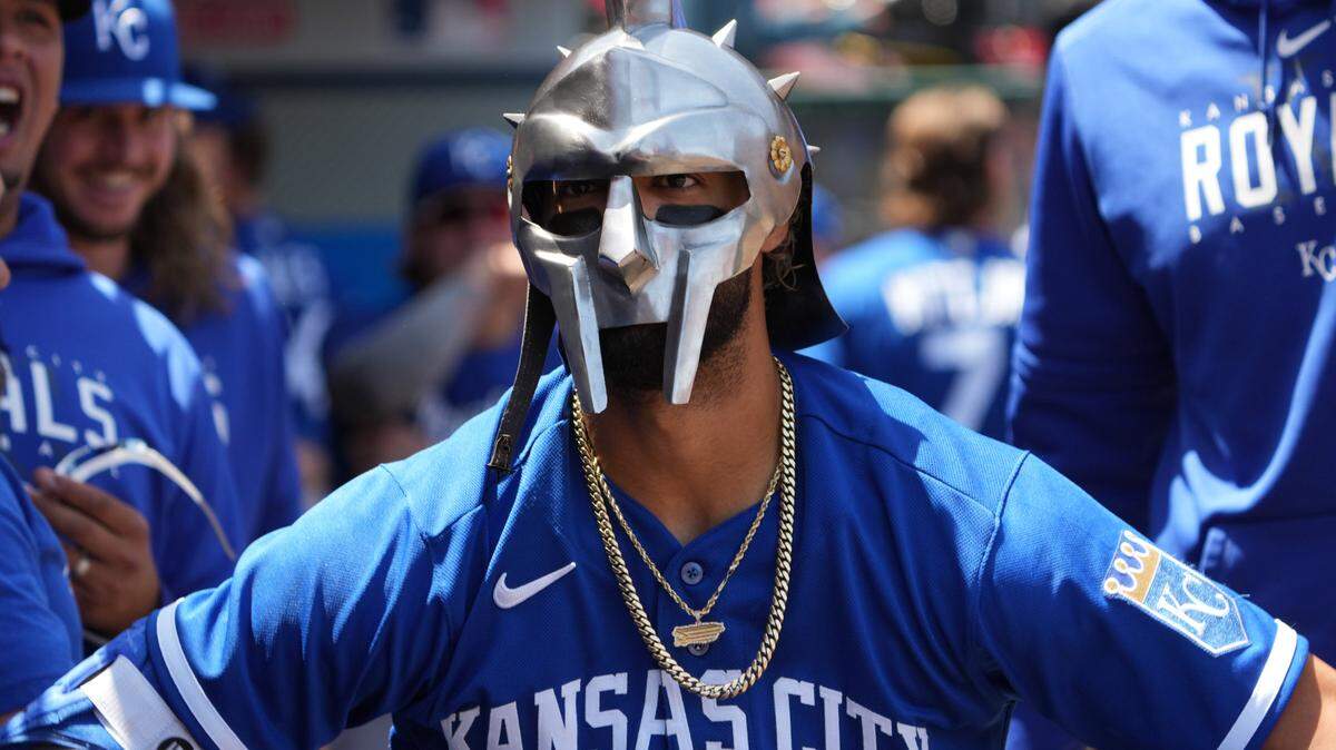 Kansas City Royals right fielder MJ Melendez dons a knight-like mask/helmet contraption in celebration after hitting a solo home run during the first inning Sunday at the Los Angeles Angels.
