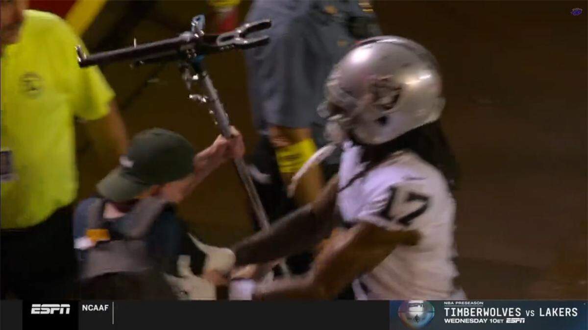 The Las Vegas Raiders’ Davante Adams is accused of shoving a camera crew member after his team’s loss to the Kansas City Chiefs on Oct. 10, 2022.