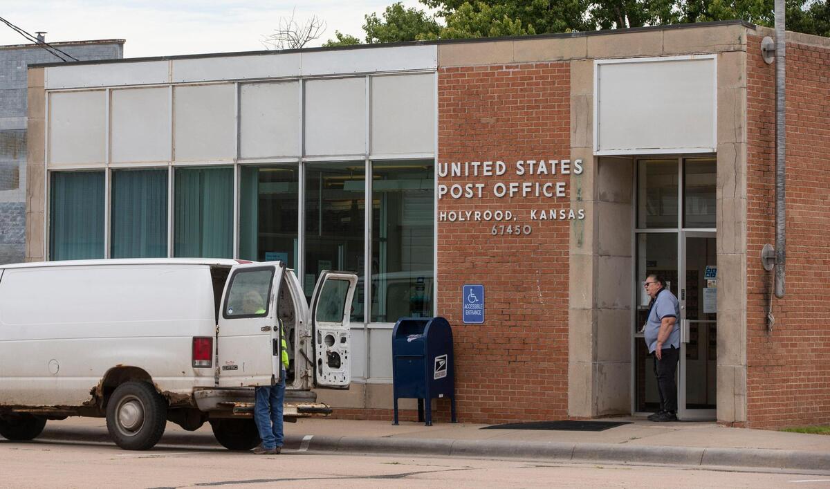 Mail for rural delivery is loaded into a van outside the Post Office in Holyrood, Kansas. Many residents in rural areas of Kansas and Missouri rely on the USPS for prescription medications and other services.