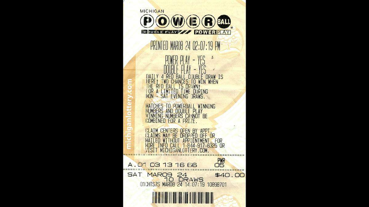 A man was suspicious of the spending alerts on his debit card. Then his wife and daughter told him he had won a prize in the Michigan lottery. 