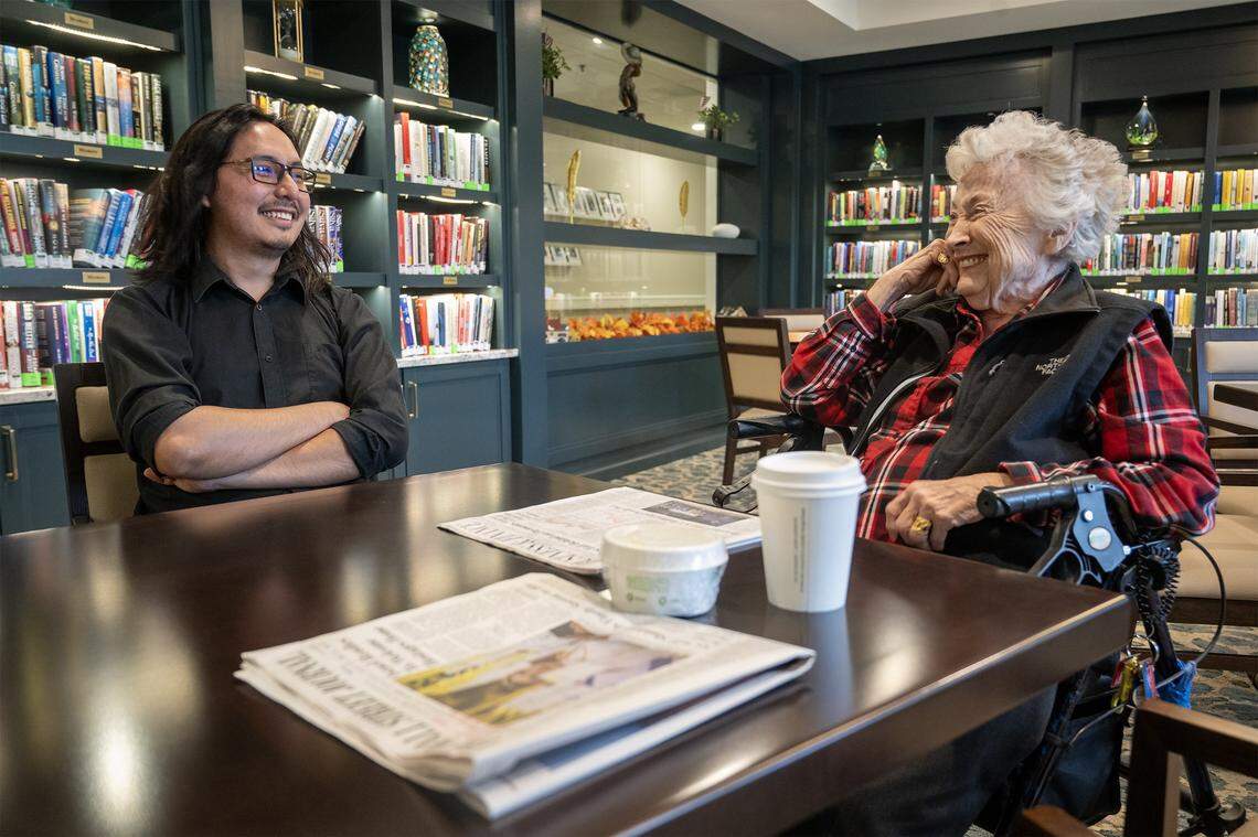 Naren Palomino Pardo, a graduate piano student at the University of Missouri–Kansas City Conservatory, visits with Joni Cooke, 93, a resident of Claridge Court, a senior living community in Prairie Village where Palomino Pardo is an artist-in-residence.  Palomino Pardo lives with the seniors and interacts with the residents daily. 