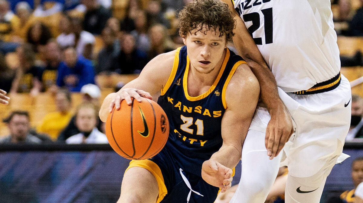 Kansas City’s Sam Martin, left, drives past Missouri’s Ronnie DeGray III during the first half of an NCAA college basketball game Monday, Nov. 15, 2021, in Columbia, Mo. (AP Photo/L.G. Patterson)