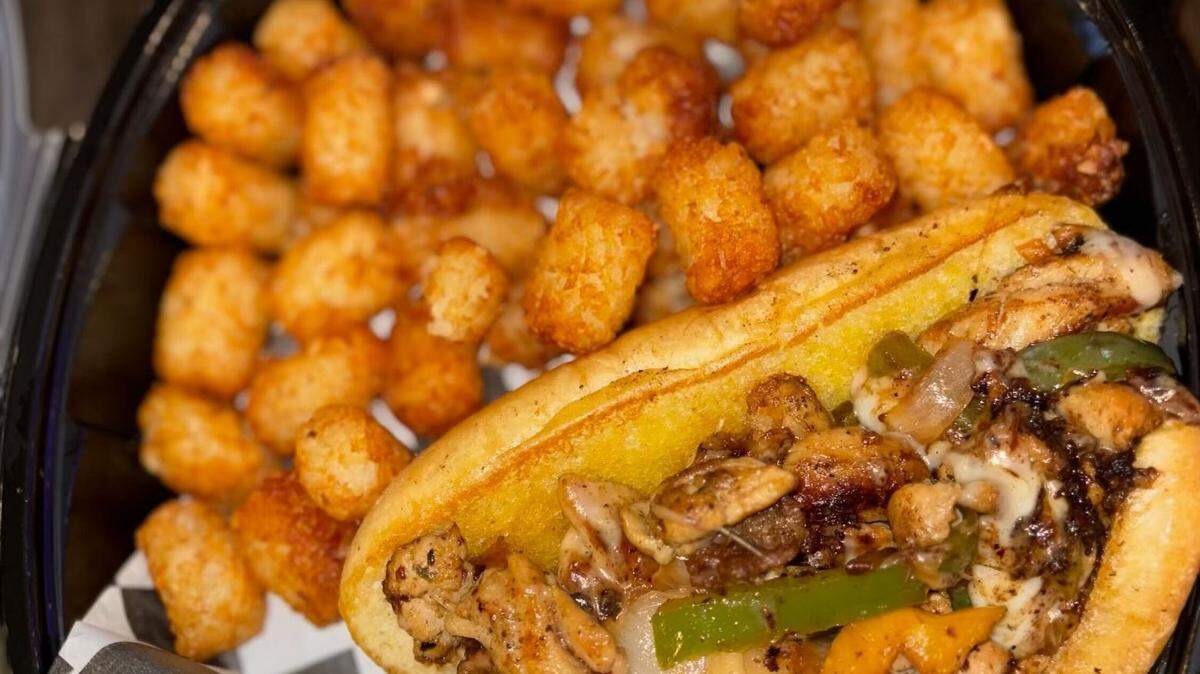 AJ’s Bar & Grill serves Philly cheesesteaks with tater tots.