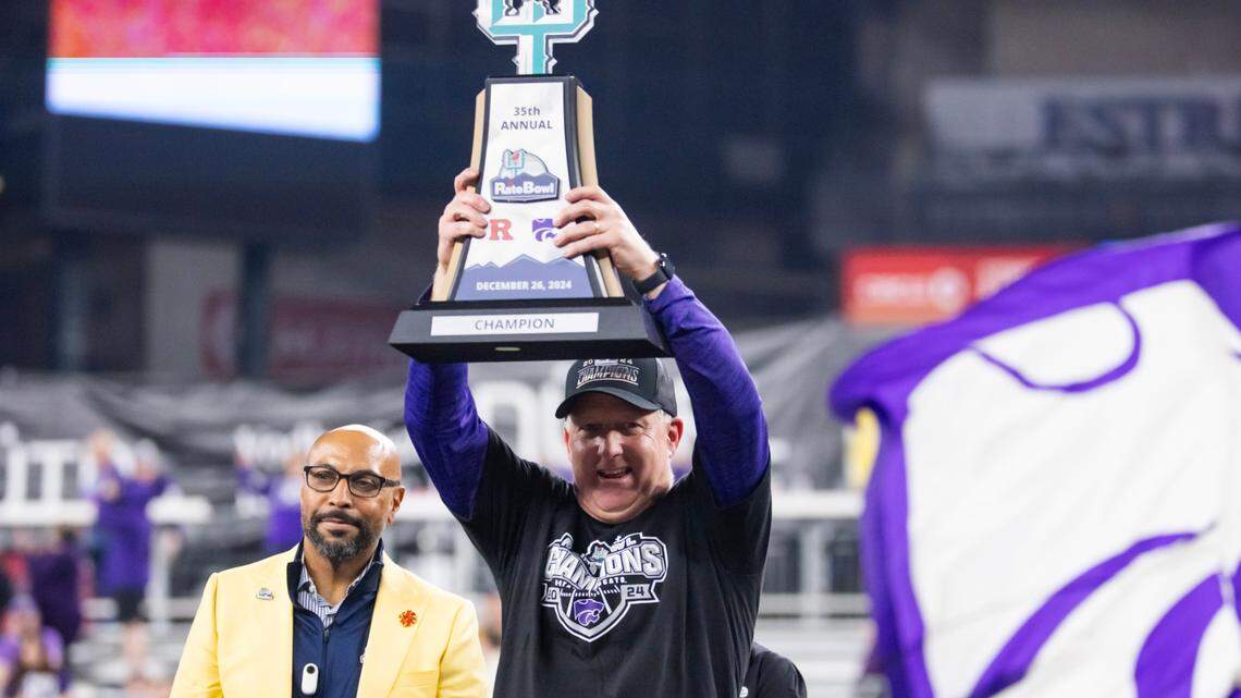 Kansas State Wildcats head coach Chris Klieman celebrates with the trophy after defeating the Rutgers Scarlet Knights during the Rate Bowl at Chase Field on Dec. 26, 2024.
