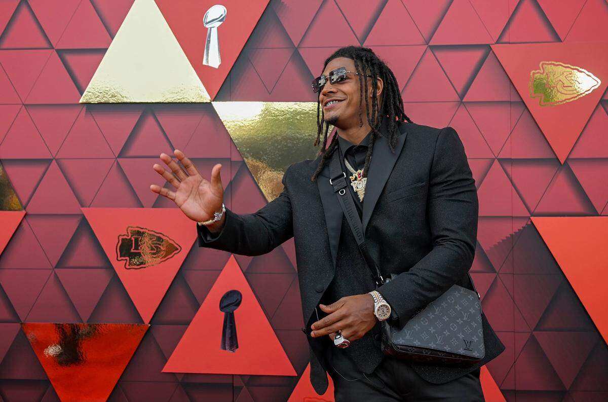 Kansas City Chiefs running back Isiah Pacheco ​carried a Louis Vuitton unisex street style leather crossbody.