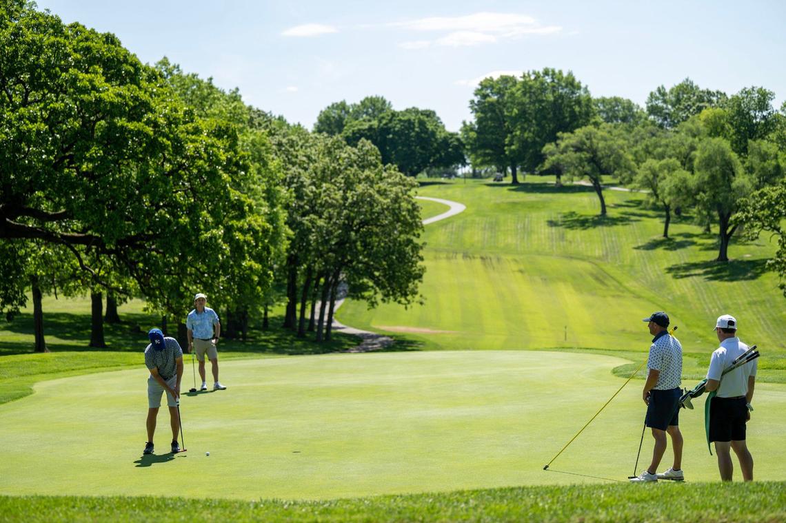 Golfers gathered on a green at Swope Memorial, which plans to close this winter for renovations and reopen in the spring of 2026.