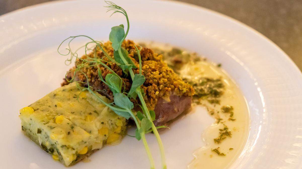 A spring menu find: Pistachio crusted lamb with mint chimichurri and herbed corn pudding at the Dining Experience at Kauffman Center.