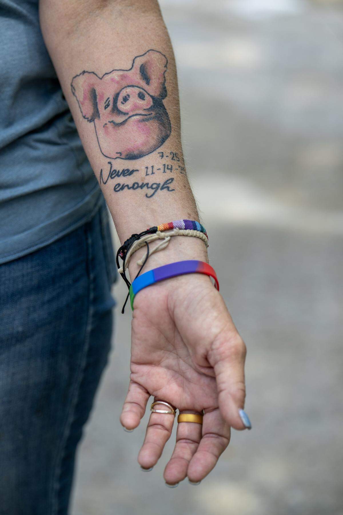 Angela Jones-Willey, Kansas City Pig Rescue Network secretary and treasurer, sports a tattoo on her forearm memorializing her longtime pig, Thad, a six-year-old, 1,200 pound pig who died of cancer in November. 