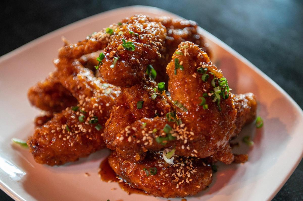 The sweet garlic glazed chicken, topped with sesame seeds and scallions, is one of two fried chicken options at Kobi-Q.