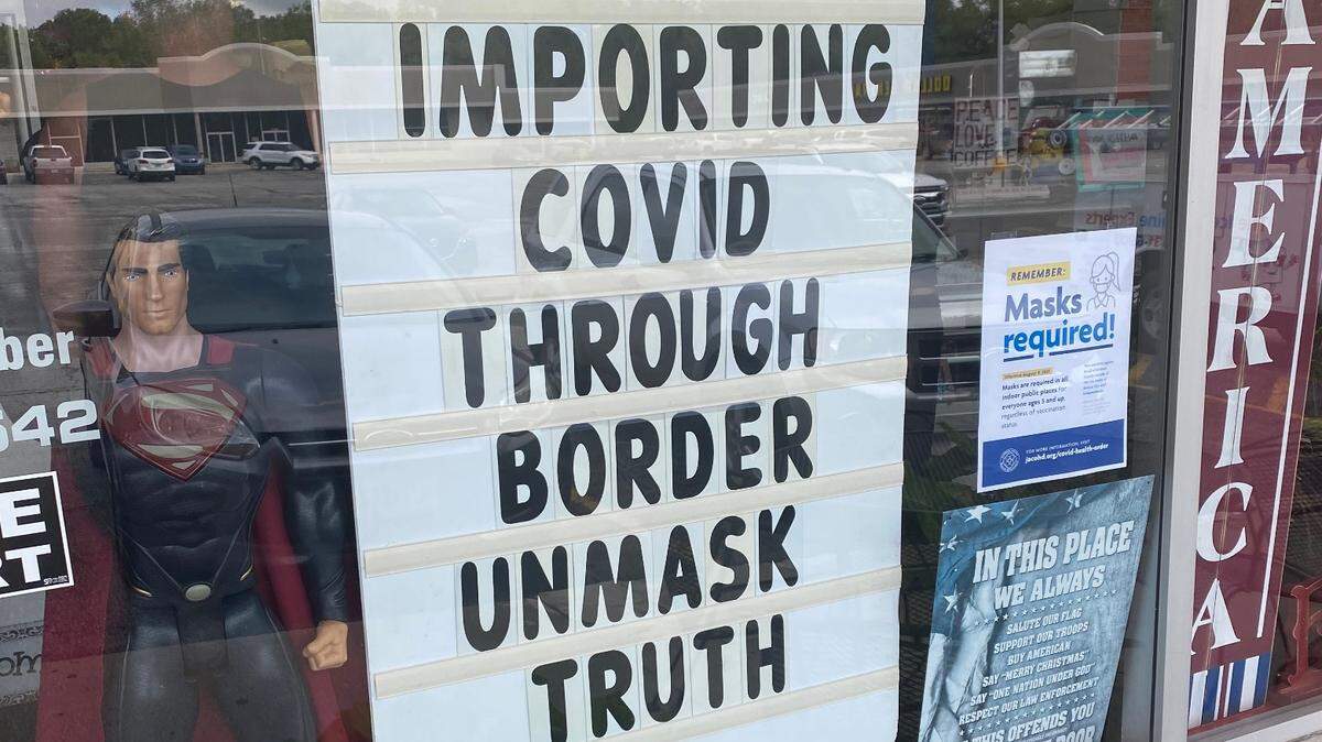Doughboys, a doughnut shop in Raytown, has displayed a sign blaming migrants for the surge in COVID-19 cases. Public health officials say there is no evidence that migrants are adding to the surge in cases. 