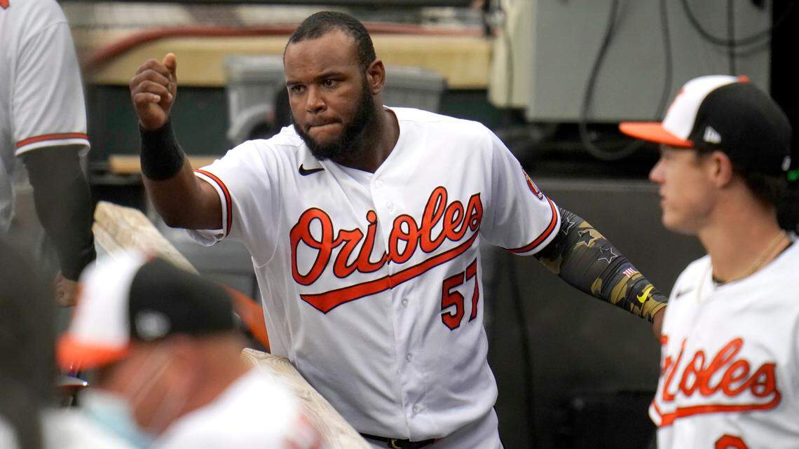 Baltimore Orioles third baseman Hanser Alberto (57) talks with teammates in the dugout prior to the first game of a baseball double header Tampa Bay Rays, Thursday, Sept. 17, 2020, in Baltimore. (AP Photo/Julio Cortez)