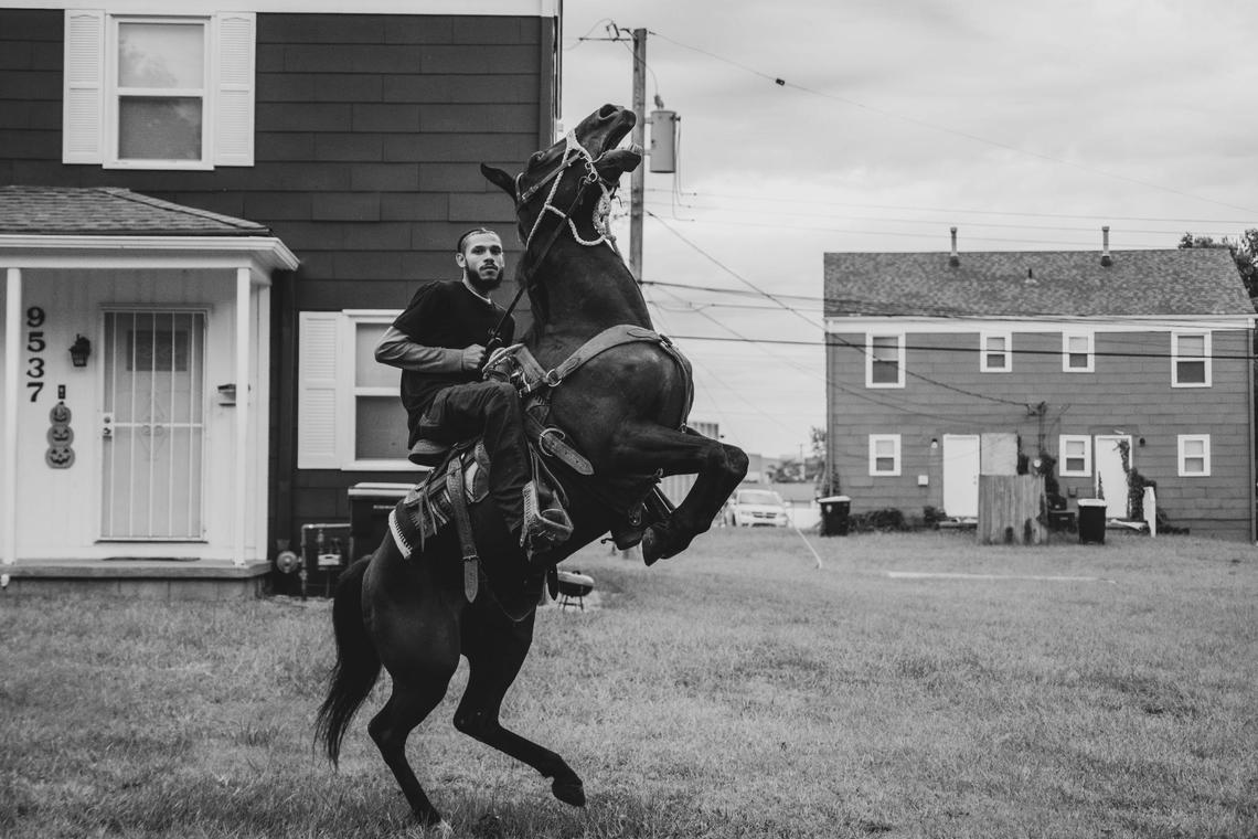 Isaiah Briscoe, aka CB Zay, rears up on his horse during a community outreach ride with KCPD in Kansas City. Briscoe, who claims he has been “riding since he was in diapers,” is one of the youngest members of the Copper Boyz at just 22 years old.