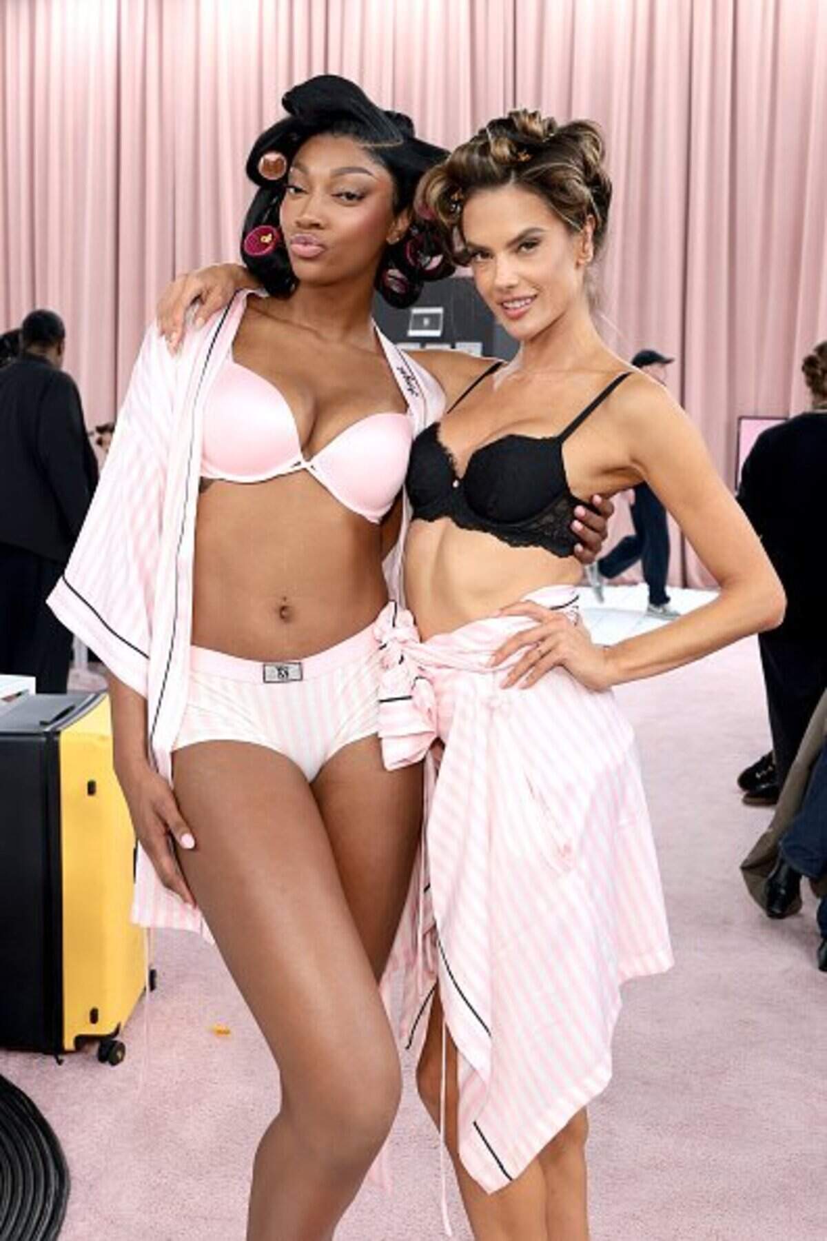 NEW YORK, NEW YORK - OCTOBER 15: (L-R) Angel Reese and Alessandra Ambrosio prepare backstage for Victoria's Secret Fashion Show 2025 on October 15, 2025 in New York City. (Photo by Dimitrios Kambouris/Getty Images for Victoria's Secret)