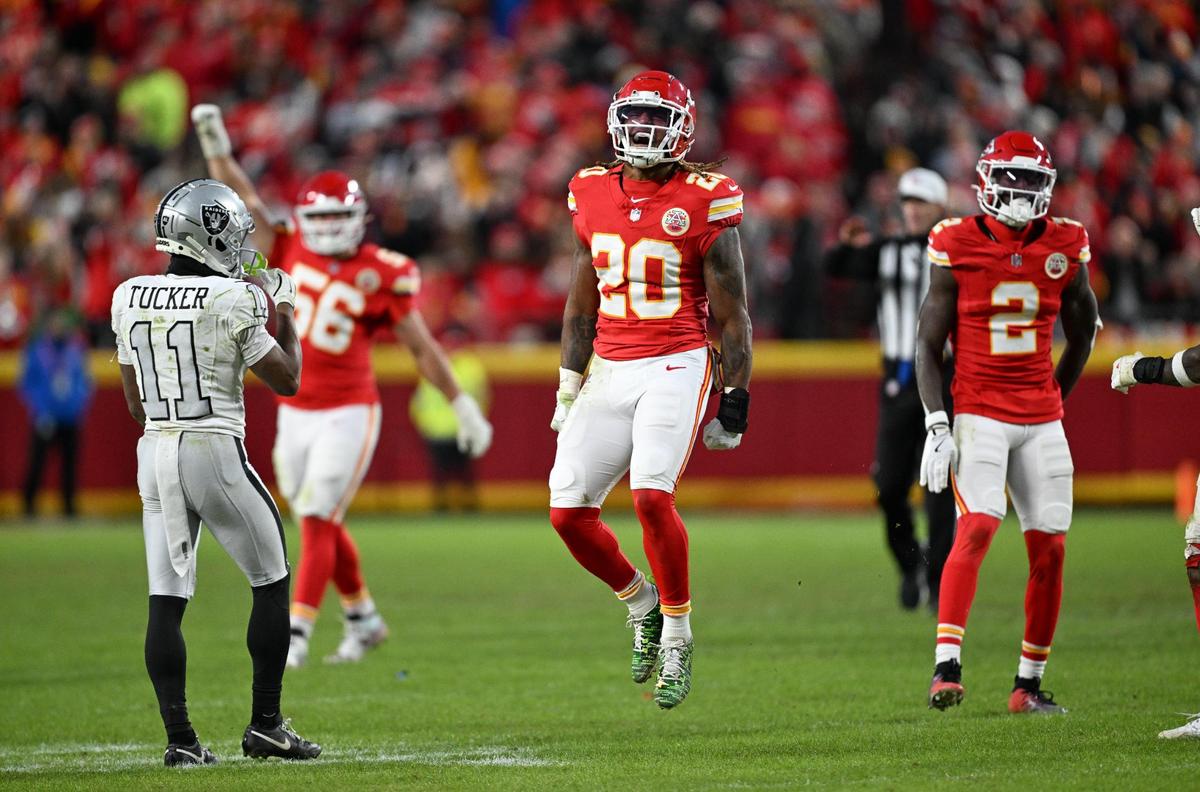 Kansas City Chiefs safety Justin Reid (20) celebrates after linebacker Nick Bolton (32) recovered a fumble on a botched snap by the Las Vegas Raiders in the fourth quarter on Friday, Nov. 29, 2024, at GEHA Field at Arrowhead Stadium.
