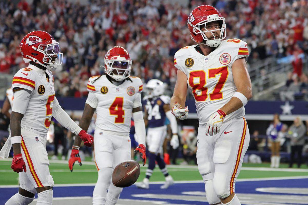 Kansas City Chiefs tight end Travis Kelce, right, celebrates a touchdown during an NFL Week 13 Thanksgiving Day game against the Dallas Cowboys at AT&T Stadium in Arlington, Texas on Thursday, Nov. 27, 2025.