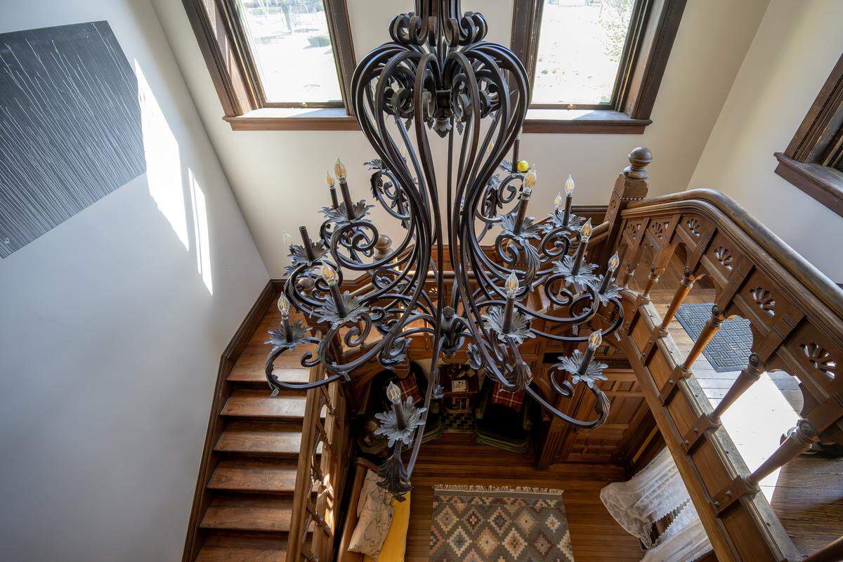 An ornate chandelier is pictured above a staircase at the Bezanson family home on Wednesday, April 8, 2026, in Kansas City.