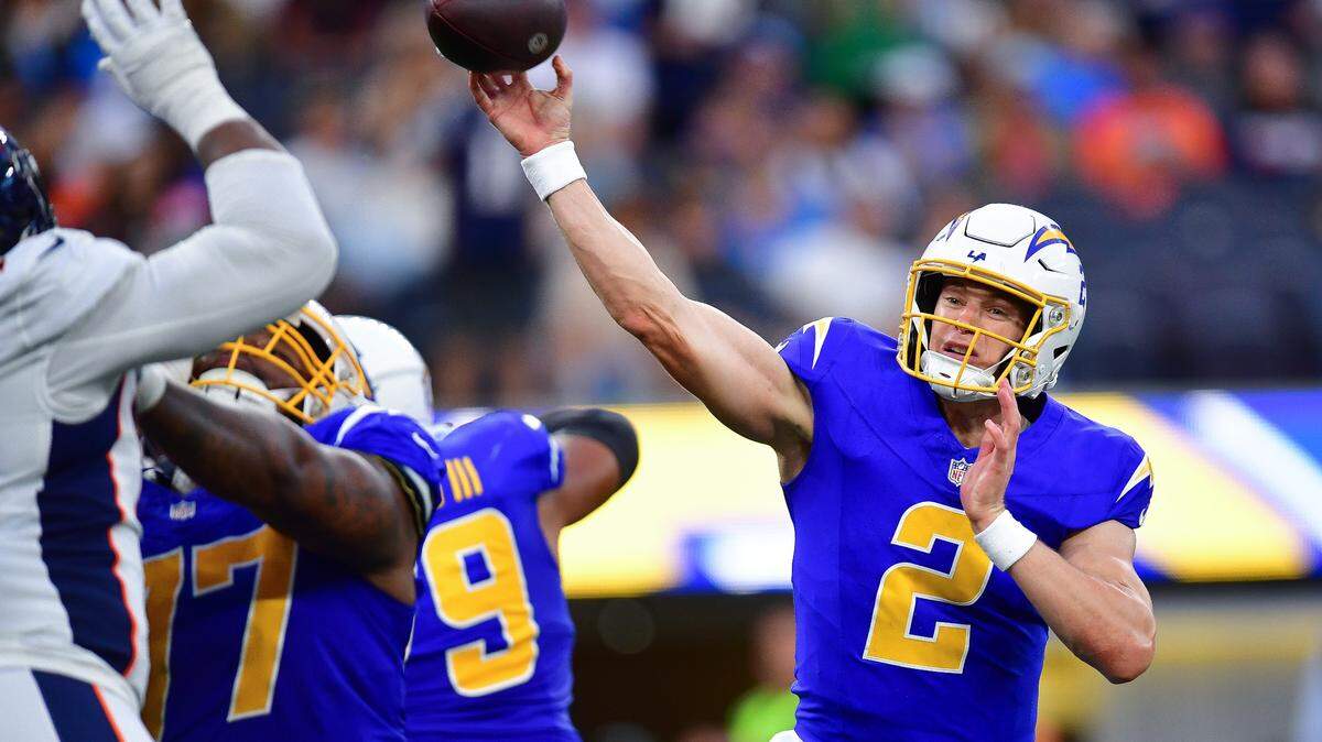 Los Angeles Chargers quarterback Easton Stick (2) throws against the Denver Broncos during the second half at SoFi Stadium.