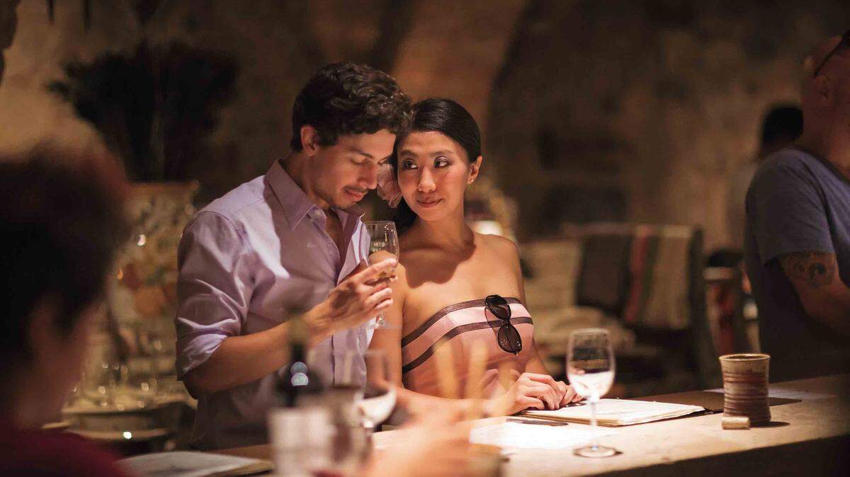 Young romantic couple on vacation in swine tasting.