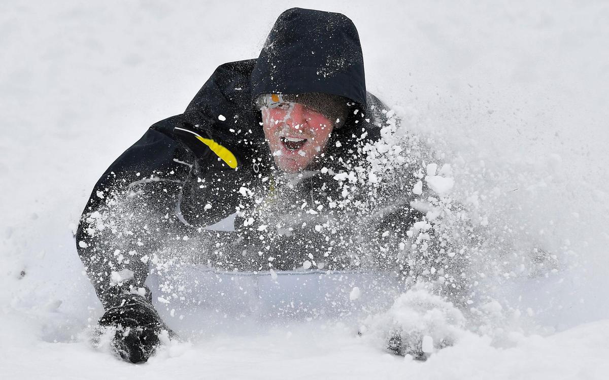 Wipeouts and laughs were abundant on ‘Suicide Hill’ after a winter storm dumped over nine inches of snow Thursday. The popular sledding destination near 57th Street and Brookside Blvd., saw lots of action after the storm subsided Thursday afternoon. Tyler Zimmerman of Kansas City, flew tumbled head first off his inflatable penguin and through the snow on this run down the hill.