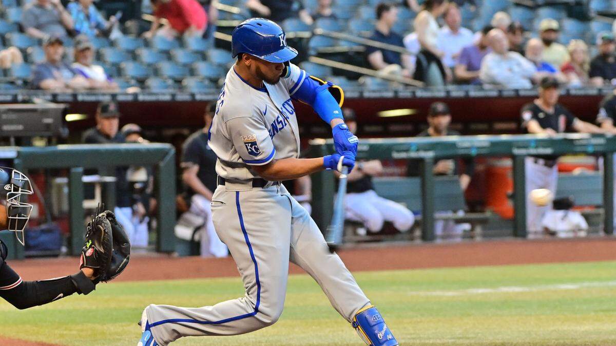 Kansas City Royals left fielder Edward Olivares (14) hits a solo home run in the first inning against the Arizona Diamondbacks at Chase Field in Phoenix on April 24, 2023.