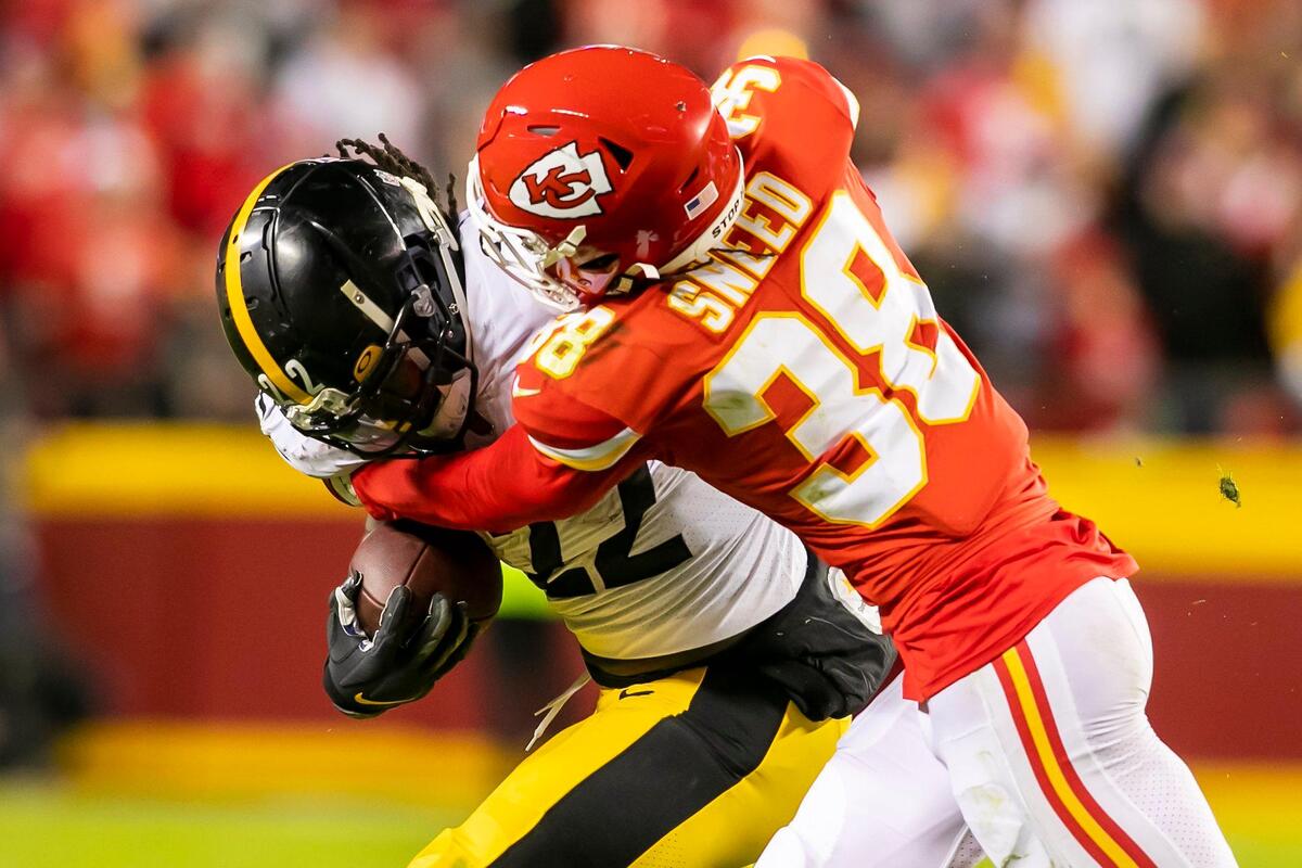 Chiefs cornerback L’Jarius Sneed (38) tackles Steelers running back Najee Harris (22) during the game between the Kansas City Chiefs and the Pittsburgh Steelers on December 26, 2021, at Arrowhead Stadium in Kansas City, Missouri. The Chiefs defeated the Steelers 36-10.
