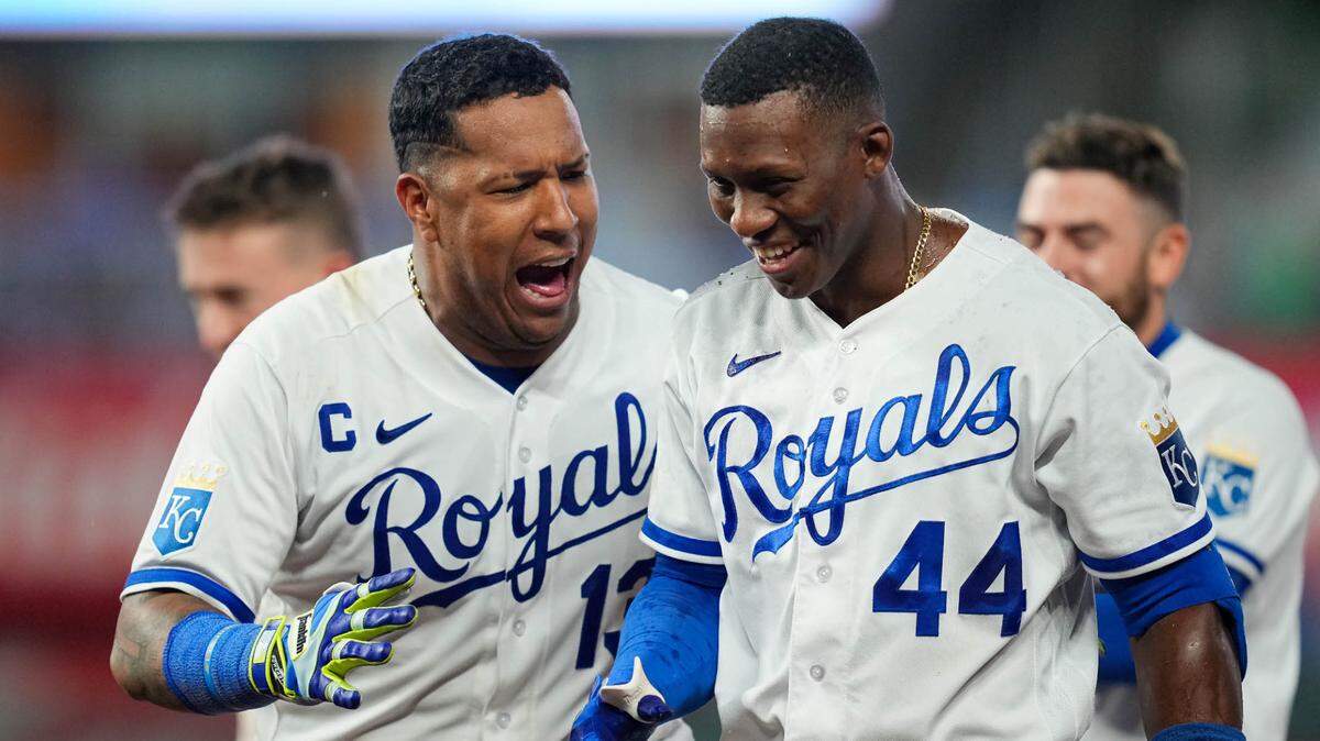 Kansas City Royals left fielder Dairon Blanco (44) celebrates with catcher Salvador Perez (13) after hitting a walk-off bunt during the ninth inning against the Seattle Mariners at Kauffman Stadium on Aug. 14, 2023.