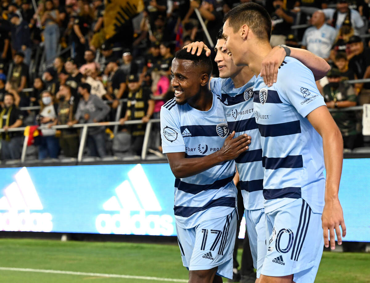 Sporting KC midfielder Gadi Kinda (17) and forward Daniel Salloi (20) celebrate after a goal by forward Alan Pulido (9) against Los Angeles FC at Banc of California Stadium on Aug. 4, 2021.
