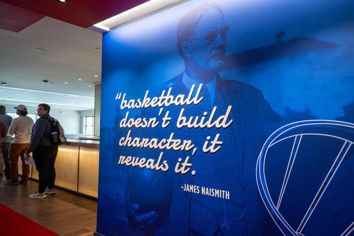 Updated graphics featuring a saying by James Naismith adorn a wall in the Naismith Room, a hospitality area at newly renovated Allen Fieldhouse in Lawrence.