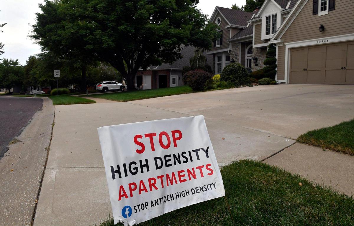 Signs opposing the construction of high density apartments are popping up in the neighborhood in and around 139th Street and Hadley in Overland Park.