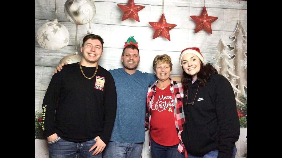 Through their Kansas City attorney, the Bellos family, above, filed a lawsuit last month alleging assault and medical negligence in an incident in April involving Donald Bellos, second from left. His family called 911 after he was suicidal and said he ingested something. While being treated inside the ambulance, Bellos was tased and a deputy punched him in the face, body camera footage shows.