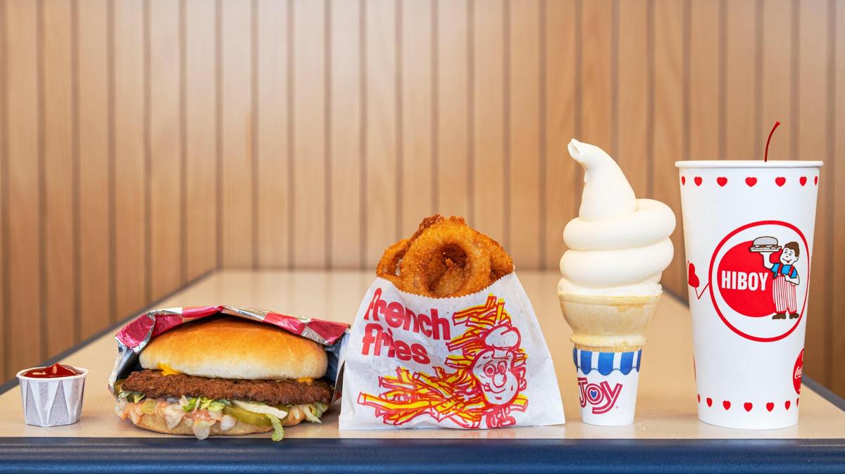 HiBoy classics: a cup of ketchup, a HiBoy Burger, onion rings, a vanilla ice cream cone and a cherry limeade rest on the same table where State Farm filmed a recent commercial with the Kansas City Chiefs’ Patrick Mahomes and Andy Reid.