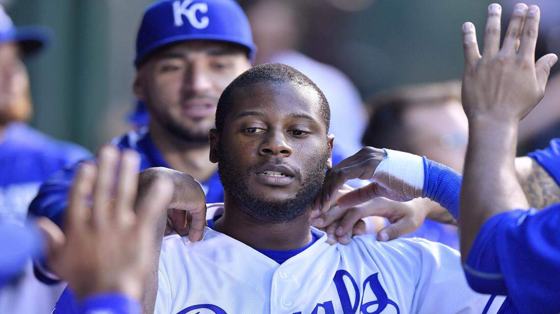 Kansas City Royals' Lorenzo Cain is greeted in the dugout after scoring on a single by designated hitter Kendrys Morales in the first inning during Monday's baseball game against the New York Yankees on August 29, 2016 at Kauffman Stadium in Kansas City.
