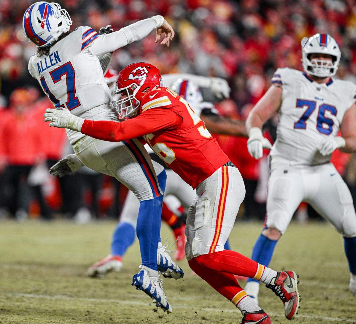 Kansas City Chiefs defensive end George Karlaftis (56) puts a hit on Buffalo Bills quarterback Josh Allen (17) as he gets a pass off late in the fourth quarter during the AFC Championship Game on Sunday, Jan. 26, 2025, at GEHA Field at Arrowhead Stadium.