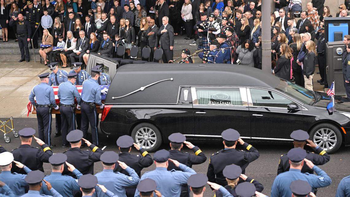 Police Officer James Muhlbauer,’s casket was loaded into a hearse after the funeral for Muhlbauer and his police K-9, Champ, Wednesday, Feb. 22, 2023, at Municipal Auditorium in Kansas City.